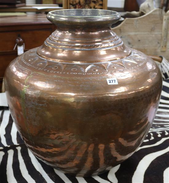 A large copper urn and a dish